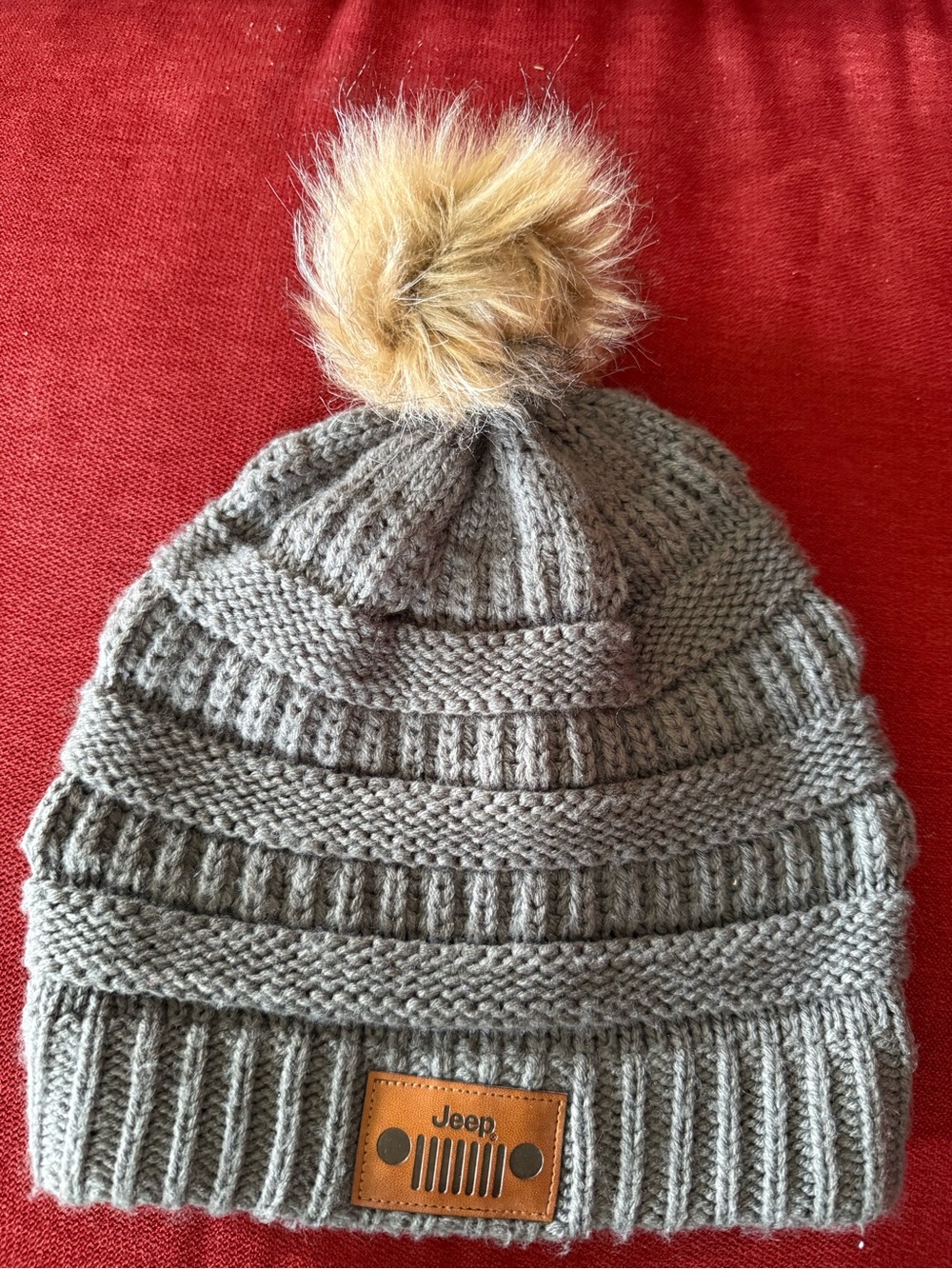 Jeep Woman’s Gray Knit Beanie with Tan Faux-Fur Pom